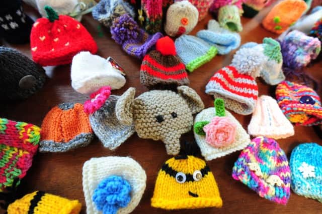 A selection of the hats made especially for Innocent smoothie bottles. Picture: Kate Shemilt