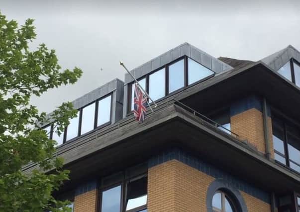 The flag above parkside at half mast
