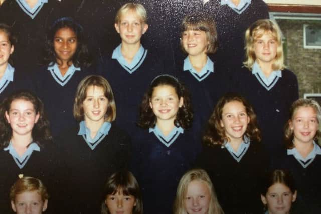 Kelly as a pupil second row from the bottom, third from the right in a hairband