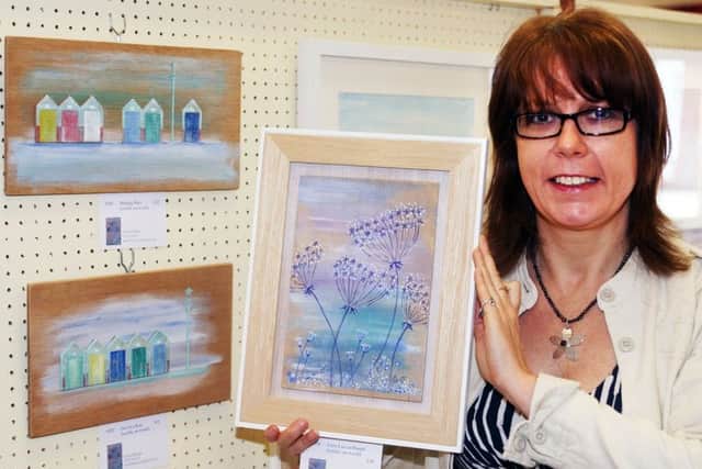 Sarah Billings with some of her paintings. Picture: Derek Martin DM17525569a