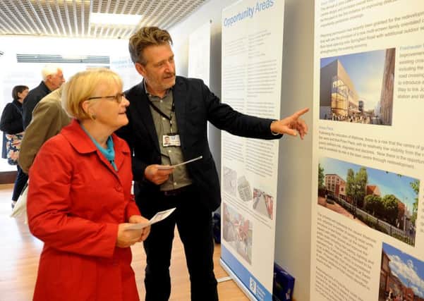 Horsham town centre vision exhibition in Swan Walk Shopping Centre. Clive Burley - Project Manager talks to members of the public. Pic Steve Robards SR1711190 SUS-170521-195423001
