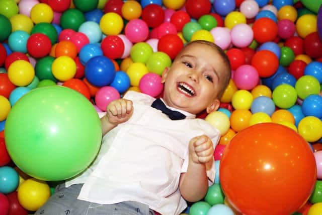Harry Ragless having fun in the ball pit DM17525610a