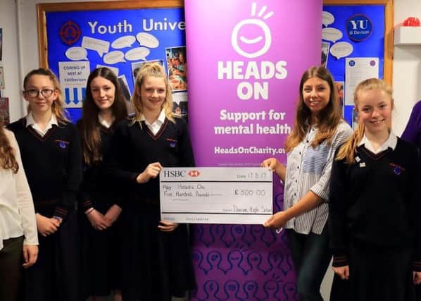 Year Eight students from Davison CE High School in Worthing present their cheque to CAMHS Psychology Intern Ruby Whish