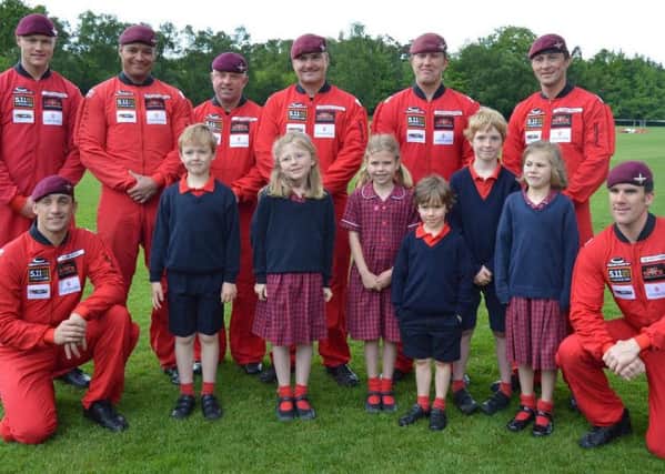 The Red Devils with some children from Brookham Pre-Prep and Nursery
