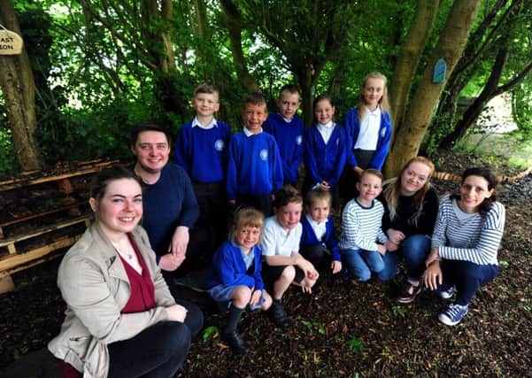 Funtington Primary School pupils are delighted with their new woodland walk, created by student teachers Toby Broom Deanna Hills and Willow Craigie. Picture: Kate Shemilt ks170909-1