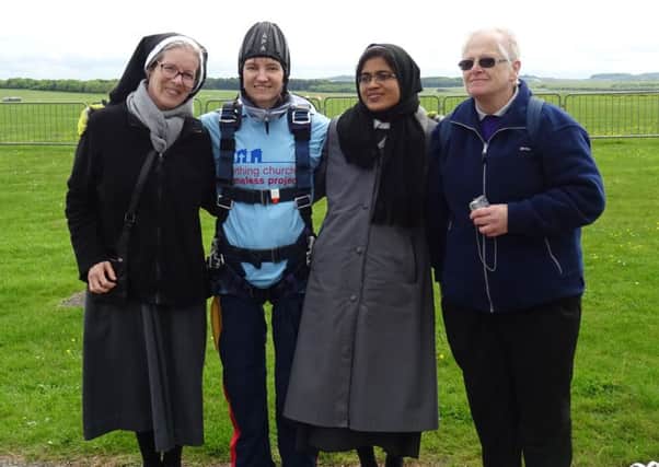Sister Clare (second from left) has raised thousands for the Worthing Churches Homeless Project by doing a skydive from a plane