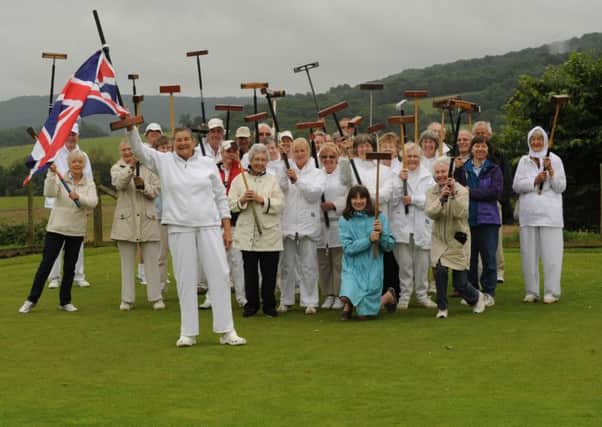 Katharine Minchin (front) and members of the Rother Valley Croquet Club celebrate the Olympic torch relay
