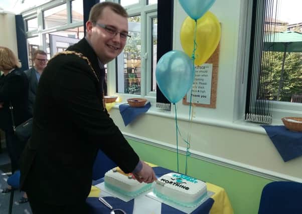 Worthing mayor Alex Harman cuts the cake to officially launch the new name, Sight Support Worthing
