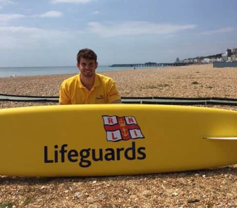 RNLI lifeguard Angus Siberry on Hastings beach. Picture courtesy of the RNLI. SUS-170524-160623001