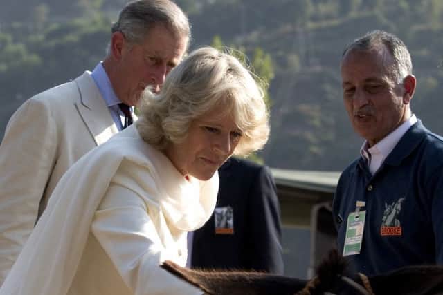 The Prince of Wales and the Duchess of Cornwall being shown equipment used during earthquake relief work. Picture: South of England Agricultural Society