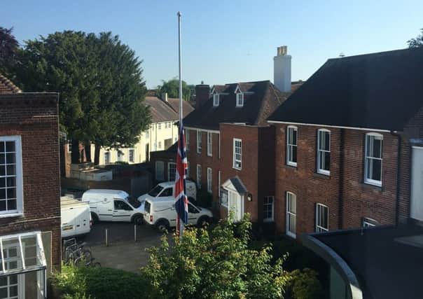 The flag flying at halfmast outside Chichester District Council