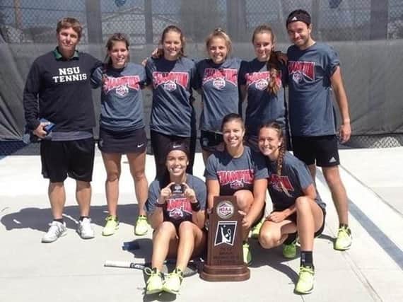 Molly Wordens NSU RiverHawks side with their MIAA championship trophy (Worden  front row, far right).