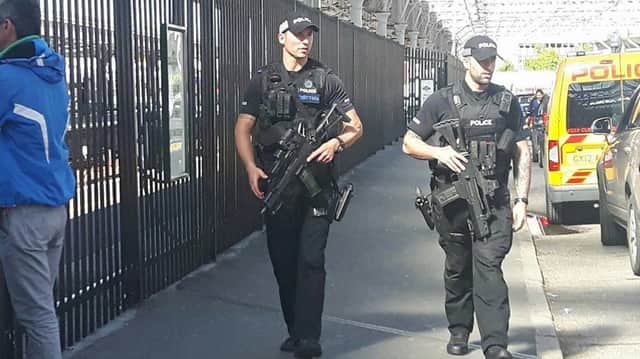 Armed police were seen patrolling Eastbourne station today (Thursday). SUS-170525-164524001