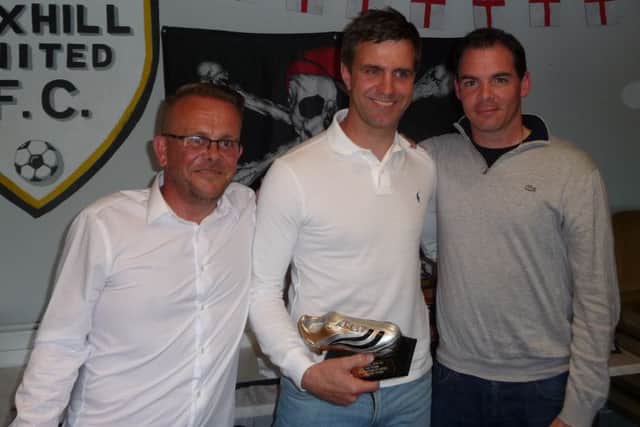 Andrew Matthews (centre) receives the second team manager's player of the season award alongside Scott Woodroffe (right).