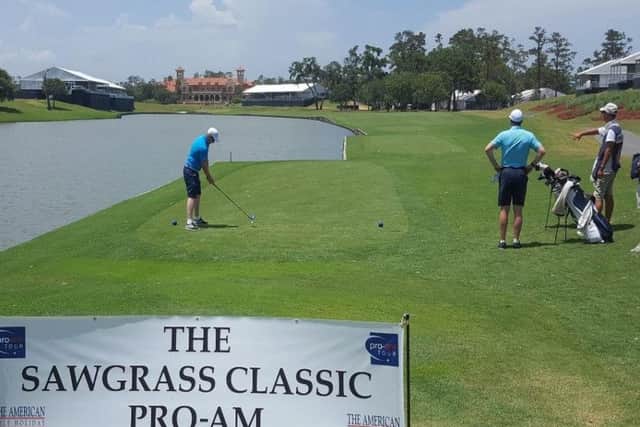 Paul Nessling drives on the 18th hole at TPC Sawgrass.