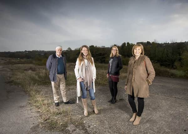 Heart of Hastings Community Land Trust board on the old power station site in Ore Valley. L-R: Rodney Buse, Tania Charman, Jess Steele and Suzy Tinker. Photo courtesy of the trust. SUS-161123-132356001