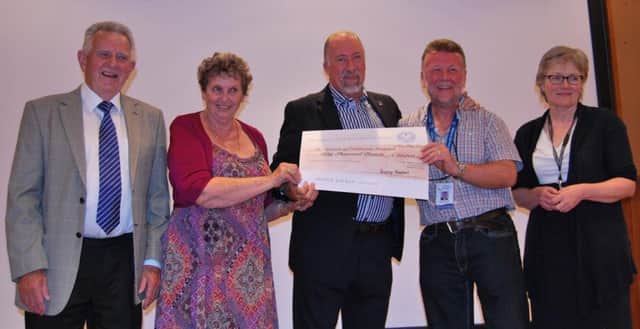 The Masons presents cheque to Friends of Eastbourne Hospital. Left to right: John and Mavis Hunt, Mike Harris of Freemasons, Harry Walmsley of FoEH and consultant oncologist Fiona McKinna celebrate. Photo by Simon Purkiss SUS-170526-124655001