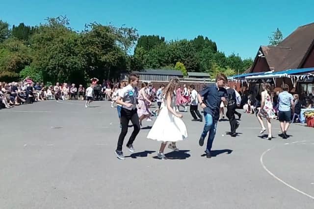 Year-six pupils at St Wilfrid's Catholic Primary School dance to She'll Be Coming 'Round the Mountain