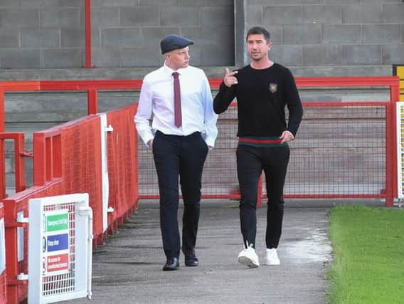New Crawley Town head coach Harry Kewell, right, goes for a walk around the Checkatrade Stadium with media and supporter liaison officer Alex Stedman.
Picture by Phil Westlake (PW Sporting Photography).