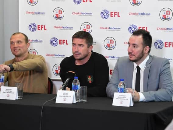 New Crawley Town head coach Harry Kewell, middle, with assistant Warren Feeney, left and director of football Selim Gayusuz, right, speaking to the press at the Checkatrade Stadium last night.
Picture by Phil Westlake (PW Sporting Photography)