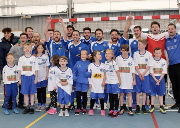 Sussex Futsal Club celebrates beating London Helvecia in the FA Futsal Cup.
