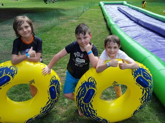 William, Archie and Noah after sliding down the Slip and Slide mat