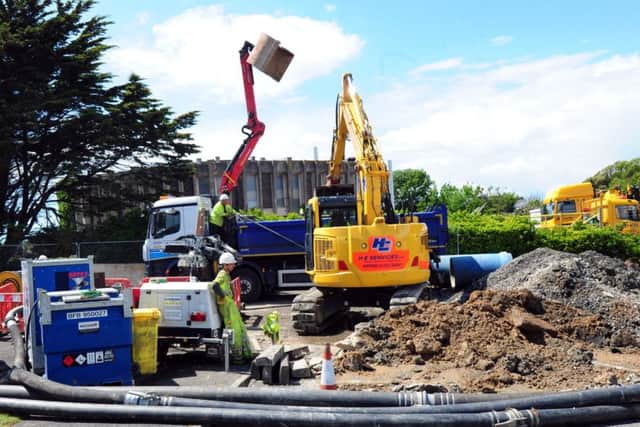 The Mewsbrook Park car park by the Littlehampton Swimming and Sports Centre being fixed after a giant pothole formed. Picture: Kate Shemilt