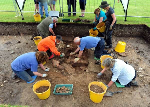 Local archaeologists digging up the bath house this week.ks170939-7 SUS-170529-222220008