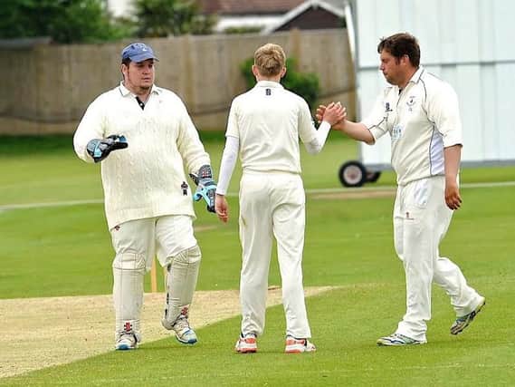 Littlehampton skipper James Askew (far, right) took five wickets in his side's win on Saturday. Picture by Stephen Goodger