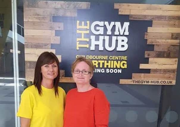 Gym Hub manager Ruth Stevens and competition winner Emma Bullock SUS-170606-094224001
