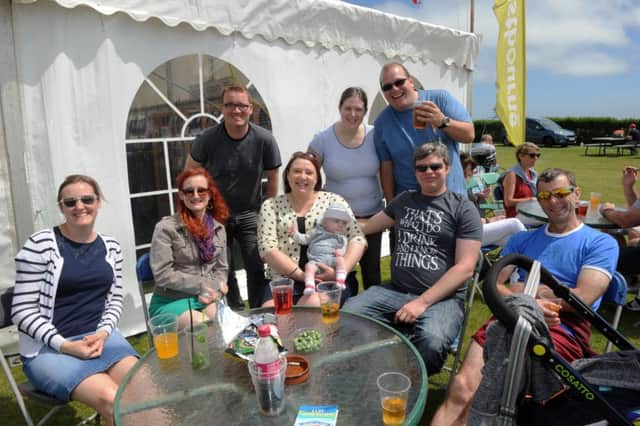 Festival fun ... happy faces in the sunshine. Photograph by Jon Rigby