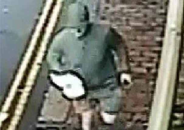 Police investigating a theft in Rye are asking the public to help identify this man. Photo provided by Sussex Police. SUS-170531-141508001