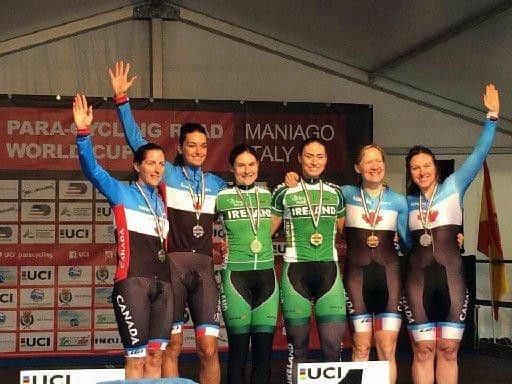 Gold medal winners Katie-George Dunlevy and Eve McCrystal, middle, on the podium in Italy.