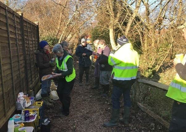 Volunteers enjoying a well-earned break while working on the FLOW Project at Cakeham Manor in West Wittering