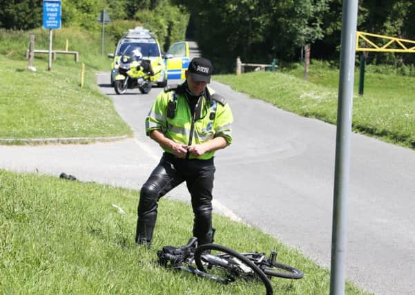 The cyclist was rushed to hospital after falling off his bike and seriously injuring himself. Picture: Eddie Mitchell