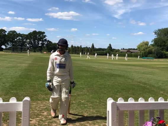 Thanvi Choudhury leaves the field at Hurstpierpoint College