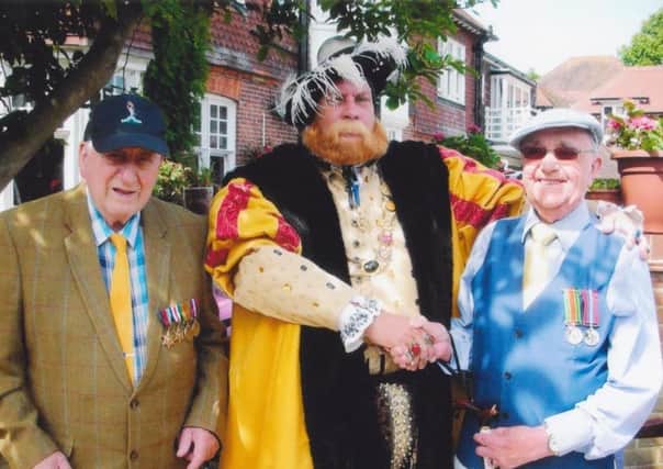 Bill was presented with his medals at the annual Mais House fete by a Henry VIII lookalike. SUS-170506-133348001