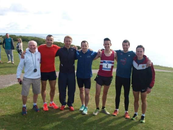 From left to right: Athletics coach Martin Delbridge (who had to drive the minibus) with his team of hardy runners: Paul Tomlinson, Marcus Kimmins, Tom Mullen, Phil Hardaway, Russ Mullen and Phil Radford.