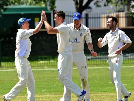 Nick Ballamy celebrates taking a wicket for Worthing on Saturday. Picture by Stephen Goodger