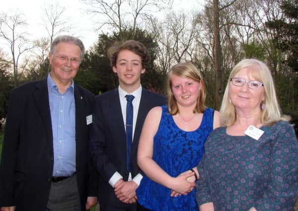 Students Holly Suter and Colin Parker with Rotarians John Bayley and Sue Virgo, who attended the Gala Graduation Night at the Ashurst Outdoor Activity Centre, near Box Hill, Surrey.