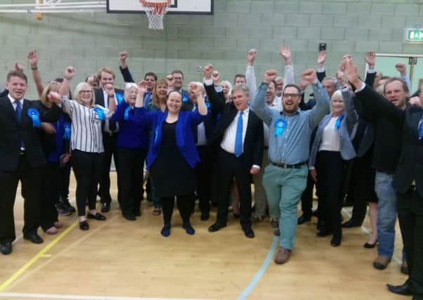 Crawley MP Henry Smith celebrates his re-election with Tory party members