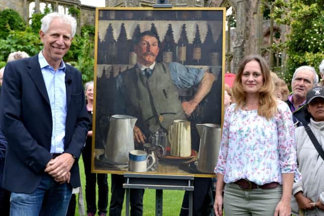 Antiques Roadshow painting expert Rupert Maas with Kelly Verstappen, from Steyning, and her portrait by the artist TC Dugdale SUS-171206-110152001