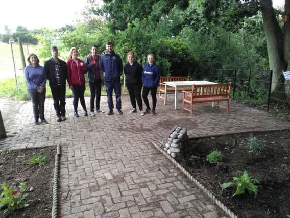Students on the Prince's Trust programme at Sussex Downs College have refurbished the outside area of Headway House