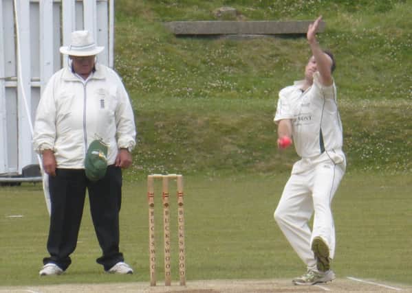 Crowhurst Park all-rounder Clive Tong steams in at the start of Hastings Priory's run chase.