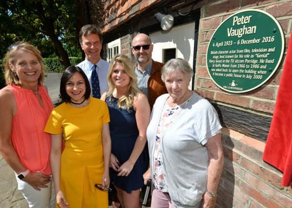 Plaque in honour of Peter Vaughn at Goffs Manor, Crawley, l-r: Peter's daughter Alex Burton; Georgia Mancio, partner of Peter's son Dave Ohm;  Anthony Woodhouse, MD of Hall and Woodhouse; Peter's grandaughter Chloe Burton; Peter's son Dave Ohm and Peter's wife Lillias.