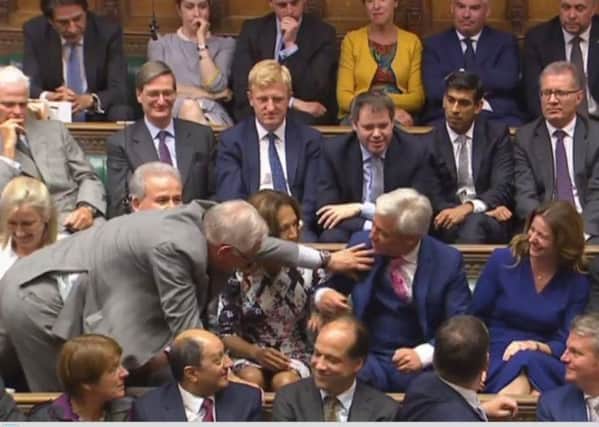 Sir Peter Bottomley, Worthing West MP, helps drag John Bercow to the speaker's chair after his re-election (photo from Parliament.tv).