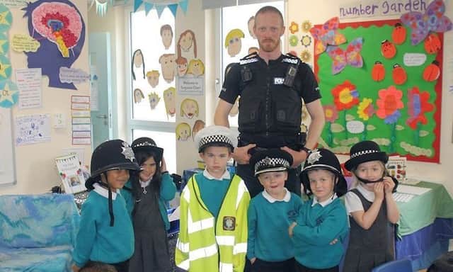 Police officer meeting school pupils