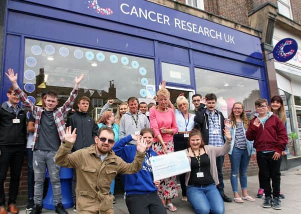Northbrook College students present a cheque to Cancer Research Charity Shop, Broadwater. Picture: Derek Martin