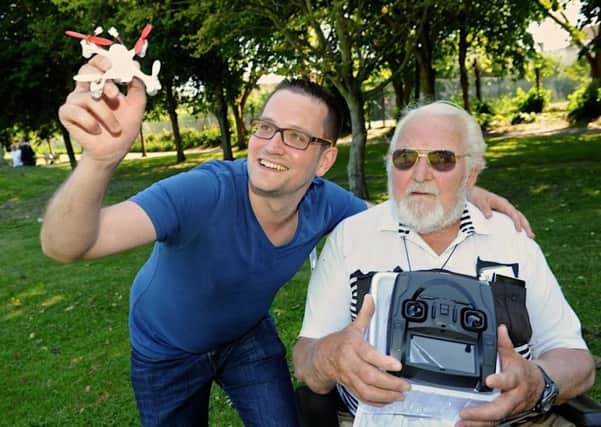 Barrie Hay (right) and Hauke Gruen with the new drone. Picture: Stephen Goodger