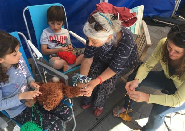 Crochet tuition at Shoreham Farmers Market on World Wide Knit in Public Day. Picture: Emily Phillips